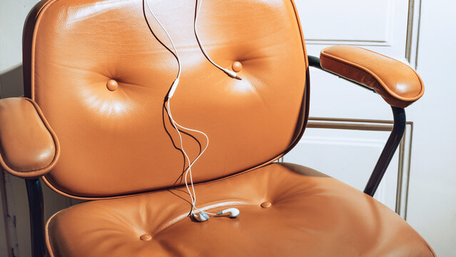 Earphones on brown chair