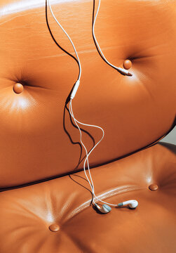Earphones on brown chair