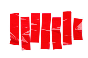 Stripes of red masking tape isolated on white background, closeup
