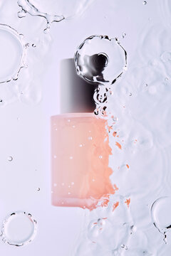 A bottle of skin care product immersed in water