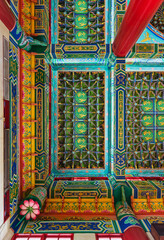 Ornate ceiling of Thean Hou Temple, Kuala Lumpur, Malaysia, featuring vibrant traditional Chinese patterns, golden dragons, and phoenixes.