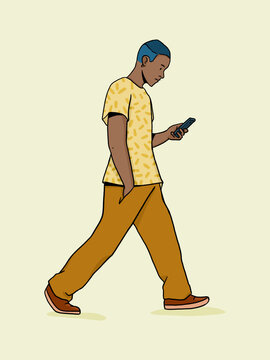 Young man walking while texting on smartphone