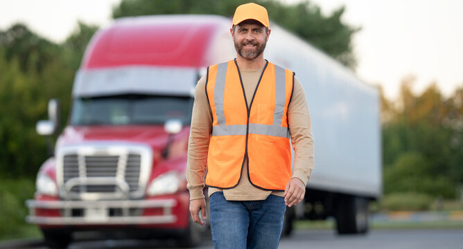 Truck driver near his semi-truck. Man in uniform and cargo lorry shipping. Professional trucker driving trailer. Logistics worker. Delivery vehicle. Semi-truck transporting. Trucker with his truck.