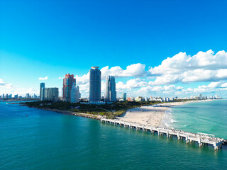 Naklejka premium Miami Beach aerial view with skyline. Miami from above. Miamis famous landmarks. South Pointe beach with skyscrapers. Miami city panorama. Summer vacation on Miami Beach.