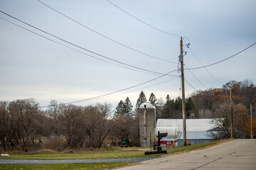 A farm with power lines on a cloudy day in Michigan