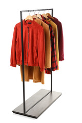 Rack with different jackets on white background