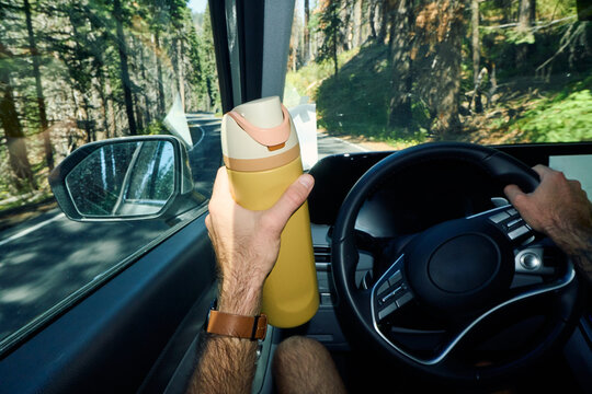 Anonymous person drives a car