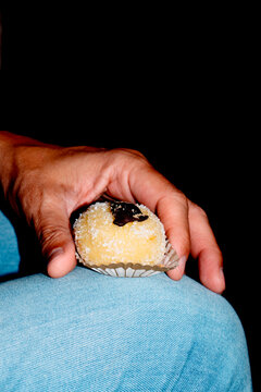 Polenta e Osei pastry from Bergamo on denim trousers
