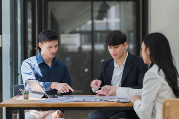 Business professionals collaborating at a meeting in modern office