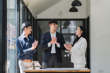 Business team clapping hands celebrating professional success