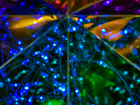 Vibrant light installation with blue, green and orange glowing strands, dynamic modern texture, futuristic bokeh abstract background for digital art - Powered by Adobe