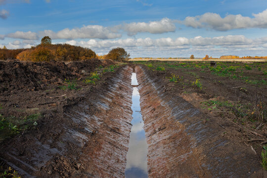A perfect new ditch in a newly acquired agricultural field.