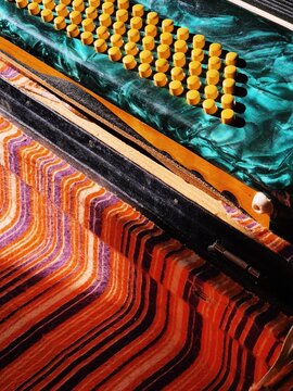 Colorful musical instrument on patterned fabric