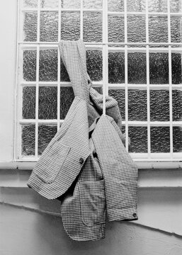 Vintage blazer stuck in a window grate