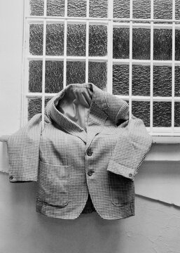 Vintage blazer arranged in a window 