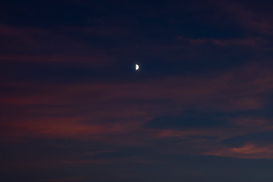 Crescent Moon Shines in a Dusky Evening Sky