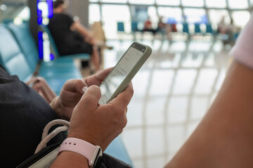 Woman hands touching a sensitive screen on a mobile phone 
