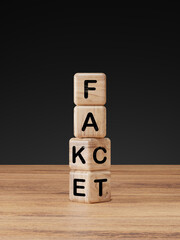 Flipping Wooden cube block for change fake to fact , news and social media concept.
