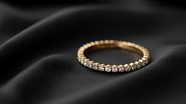 Elegant diamond eternity ring on luxurious black silk fabric