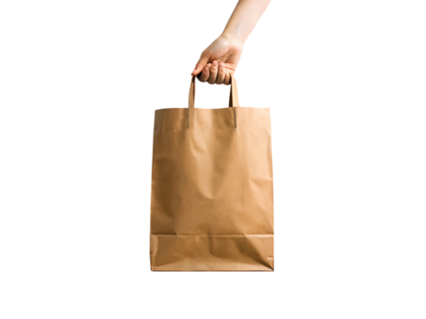 Hand holding a brown paper shopping bag isolated on black background isolated on white background isolated on transparent background