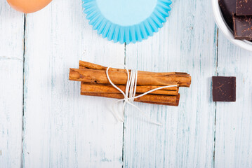 muffin baking ingredients on white wooden table