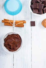 muffin baking ingredients on white wooden table