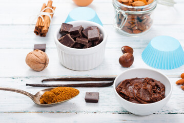 muffin baking ingredients on white wooden table