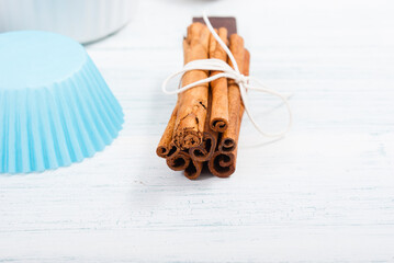muffin baking ingredients on white wooden table
