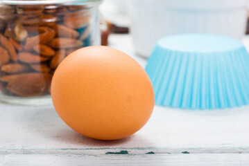 muffin baking ingredients on white wooden table