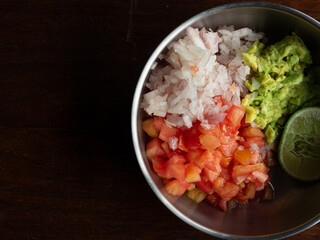 finely chopped tomato, shallot and avocado, and lime