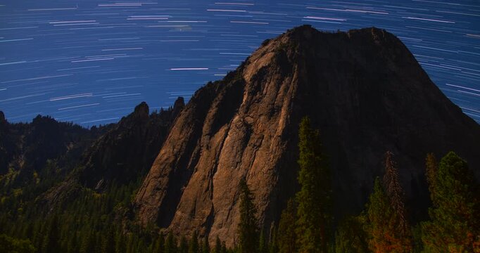 Star Trails Above Granite Peaks &ndash; Yosemite Night Sky Timelapse of Stars Moving Over Moonlit Mountains