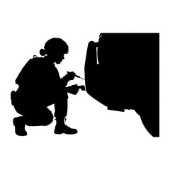 Soldier repairing vehicle with tool military