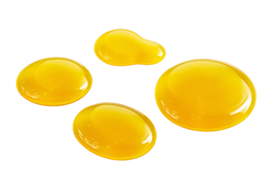 honey drops isolated on white background.