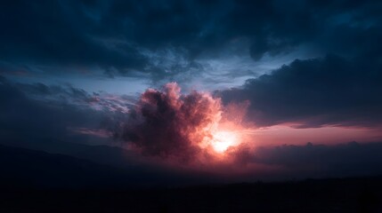 Fototapeta premium Dramatic sunset illuminates the sky with vibrant pink and orange hues breaking through dark atmospheric clouds over a silhouetted mountain landscape