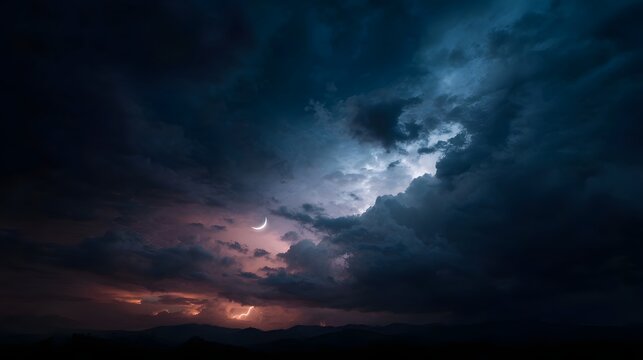 Dramatic crescent moon shines through dark stormy sky with lightning flashes over silhouetted mountains