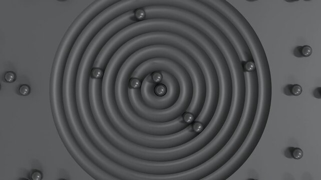 Abstract 3D top-view animation of charcoal spheres rolling in circular grooves on dark gray surface, generating surreal futuristic background with minimal conceptual geometry and smooth motion design