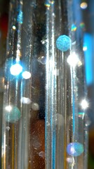 effect with silver and blue tones stretching in elongated reflective streaks