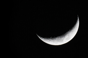 Waxing crescent. The illuminated surface of the moon is 21% and growing larger