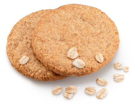 Oatсakes or oat biscuits and several rolled oats isolated on white background. File contains clipping paths.