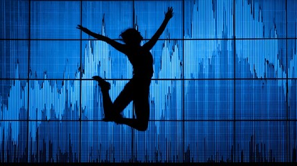 Silhouette of energetic person jumping against a bright blue illuminated data display