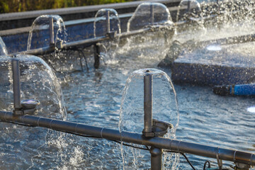 Fountain with a clear dome on top and water spraying out of it