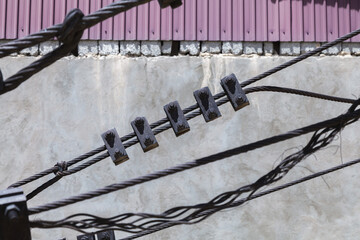 Wire with five metal clips hanging from it