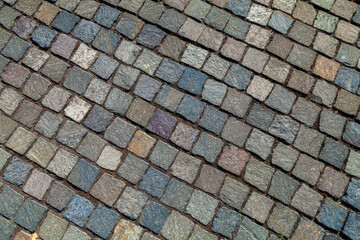 Texture of old cobblestone pavement surface