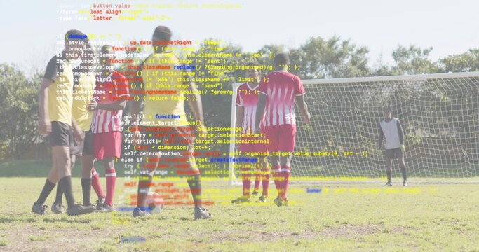 Preparing free kick yellow-jersey athlete placing ball on pitch near goal net with defensive wall