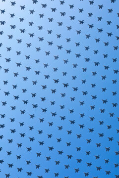 Pattern of fighter jets filling blue sky