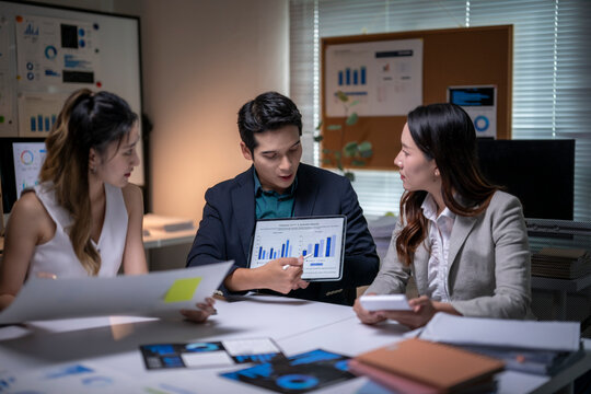 Business people discussing data analysis during corporate meeting