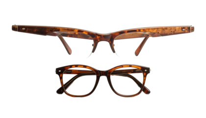 Tortoiseshell glasses, one folded, one frontal view, on black