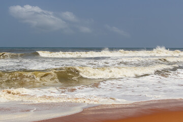 Dynamic Ocean Waves Crashing and Foaming on a Wide Shoreline