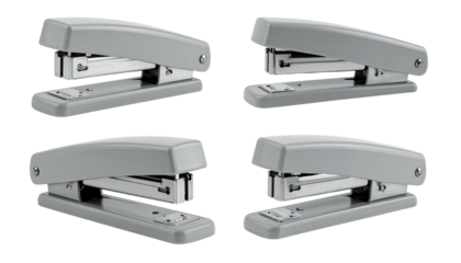 Four gray staplers, each at a different angle, on black