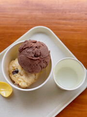 Homemade organic vanilla ice cream with mint, lemon ice cream and chocolate. Summer rest. Delicious and sweet dessert